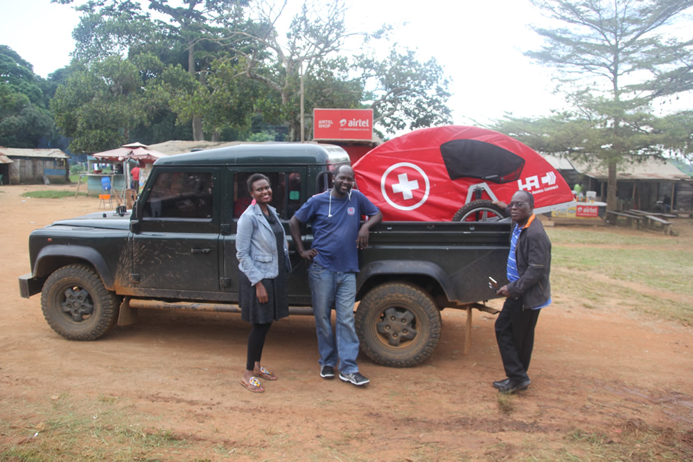 Members of the Land Rover Club while donating a village ambulance in Kalangala