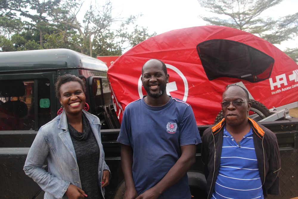 Members of the Land Rover Club while donating a village ambulance in Kalangala