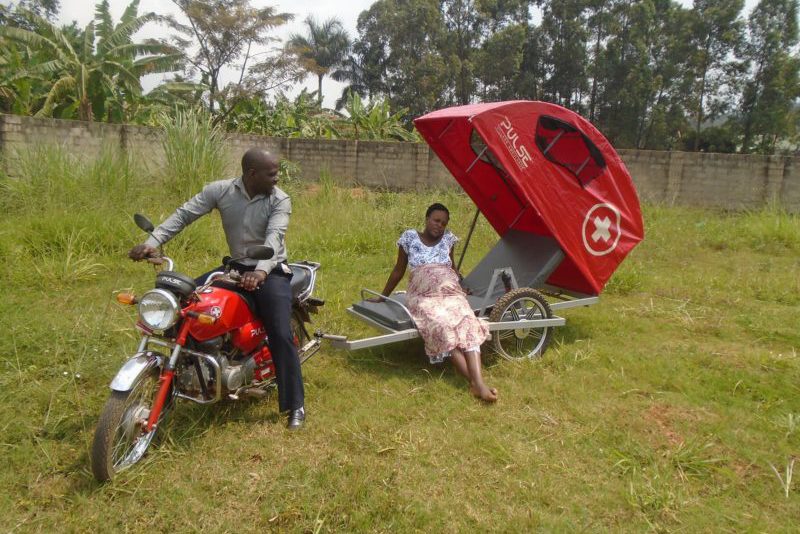 Members of the Land Rover Club while donating a village ambulance in Kalangala